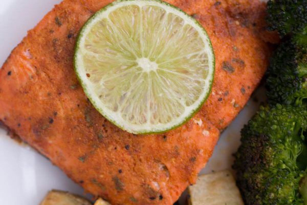 sutter buttes Cajun seasoned salmon with a lemon sitting on top